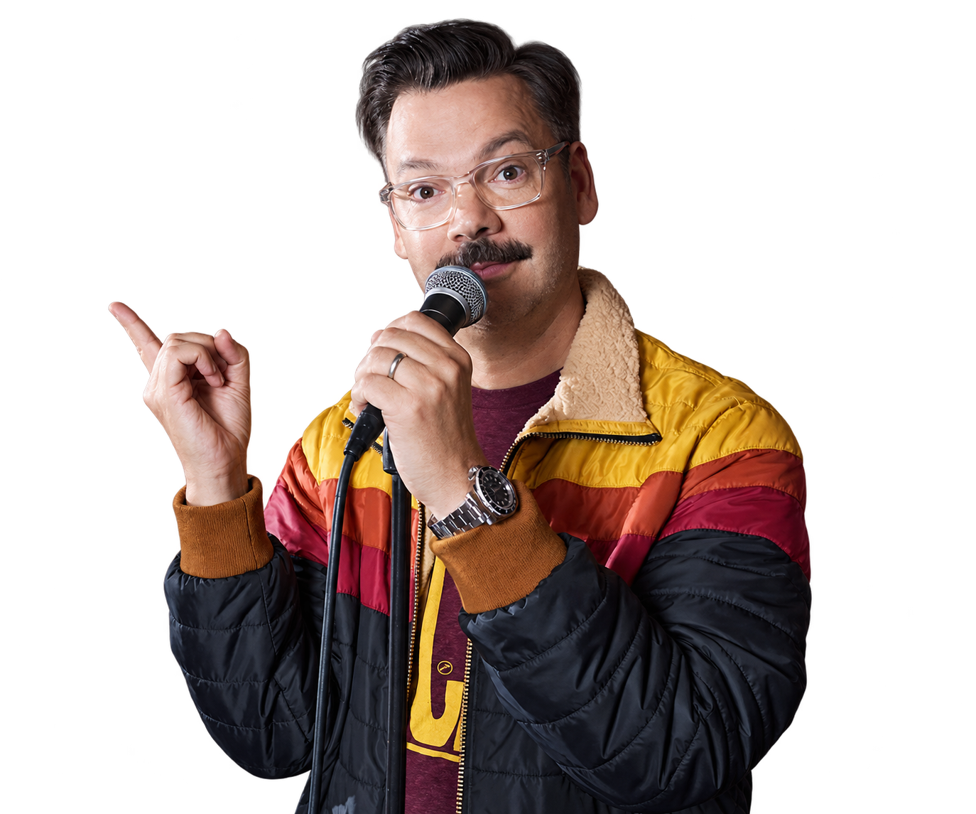 Derek holding a microphone, with one hand raised